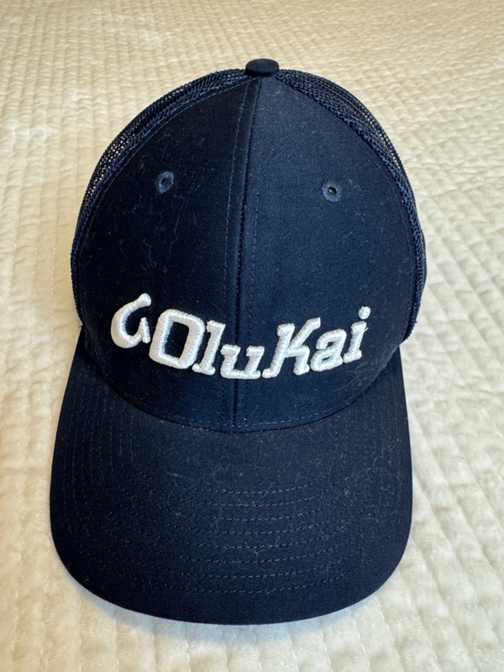 OluKai Navy Trucker Hat with White Script Logo